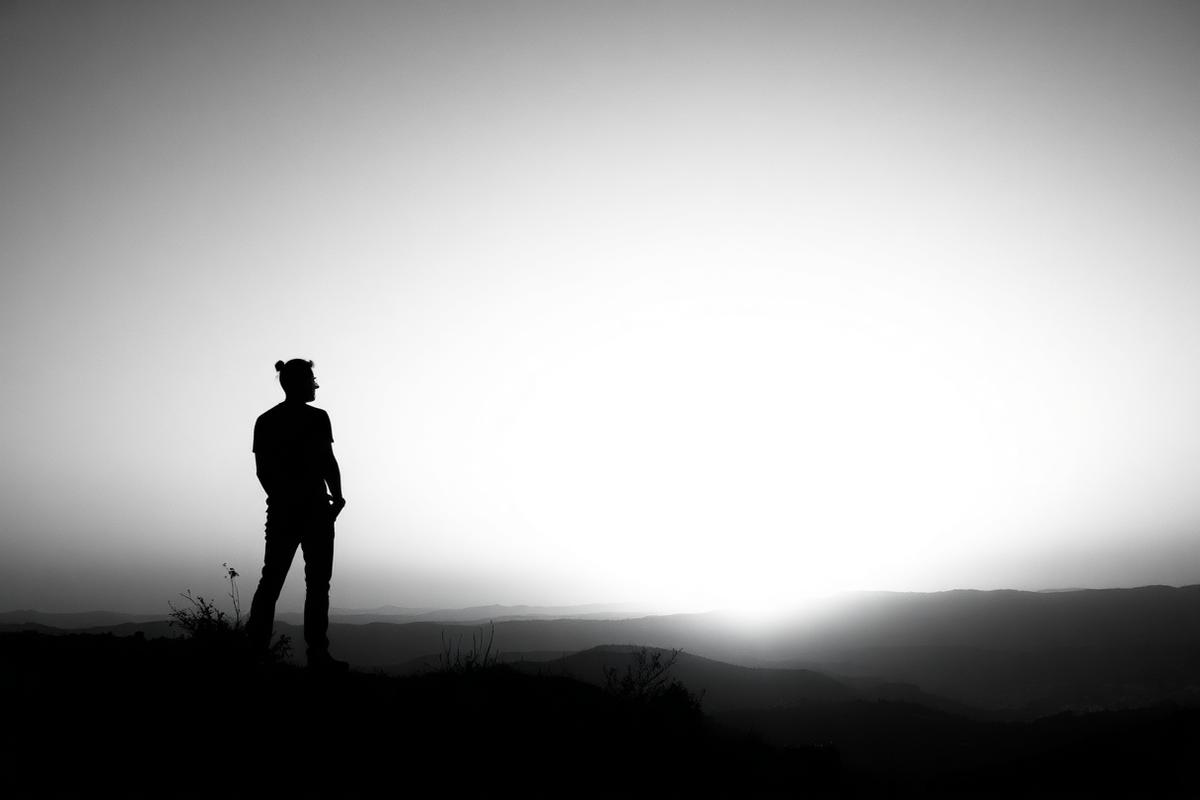 A solo traveler at sunset